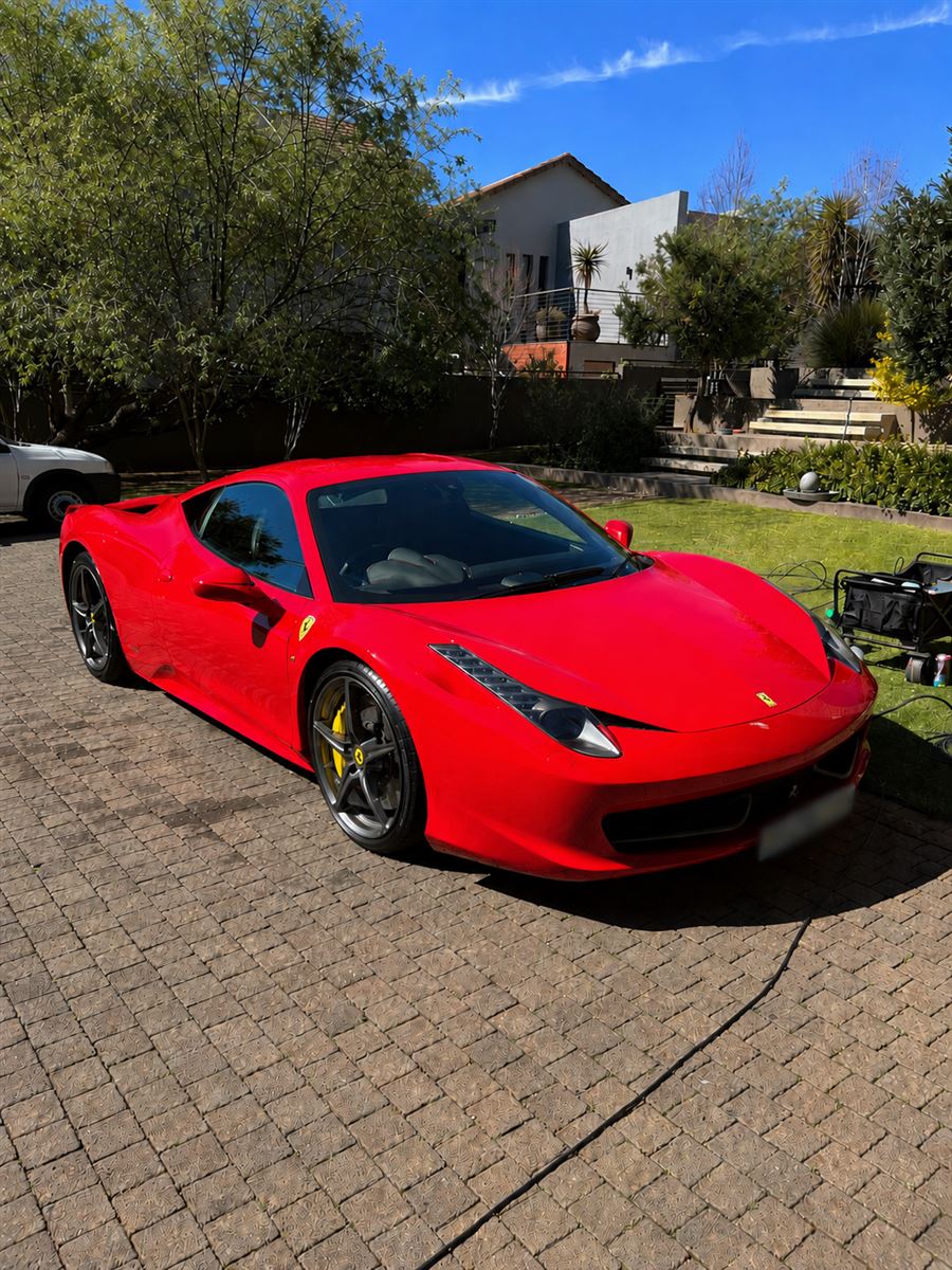 Freshly detailed red Ferrari 458 Italia, front three-quarter